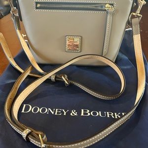 Dooney & Bourke light brown beacon dome crossbody bag. Comes with dust bag.